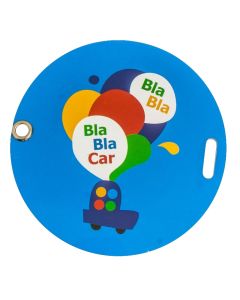 A round customized luggage tag made from plastic with full colour print and a grommet cut out hole.