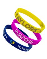 Three custom branded silicone event wristbands with custom debossing and inkfill from Custom Lanyards Canada for promotions.