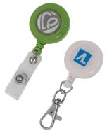 Two custom branded dome badge pullers. On has an ID tag, the other has a metal clip attachment. Both have promotional print.