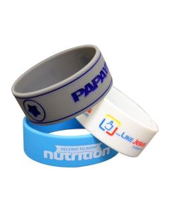 Three thick custom wristbands in Canada made from silicone in different colours with promotional printed messages.